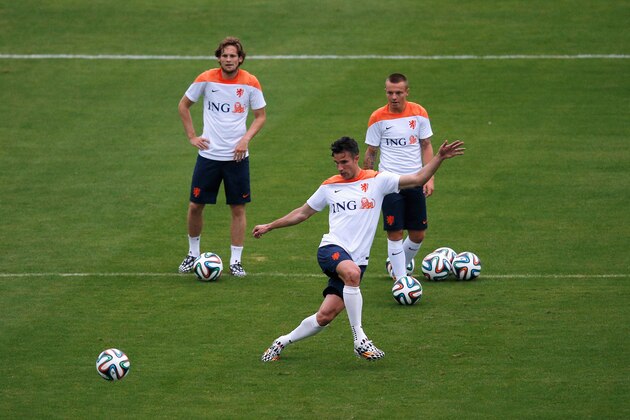 RIO DE JANEIRO, BRAZIL - JUNE 10:  Jordy Clasie, Robin van Persie (kicking the ball) and Daley Blind in action during the Netherlands training session at the 2014 FIFA World Cup Brazil held at the Estadio Jose Bastos Padilha Gavea on June 10, 2014 in Rio de Janeiro, Brazil.  (Photo by Dean Mouhtaropoulos/Getty Images)