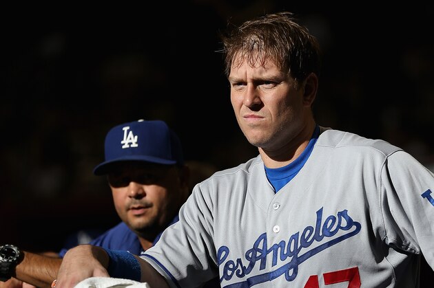 PHOENIX, AZ - MAY 17:  A.J. Ellis #17 of the Los Angeles Dodgers in the dugout before the MLB game against the Arizona Diamondbacks at Chase Field on May 17, 2014 in Phoenix, Arizona.  The Diamondbacks defeated the Dodgers 18-7.  (Photo by Christian Petersen/Getty Images)