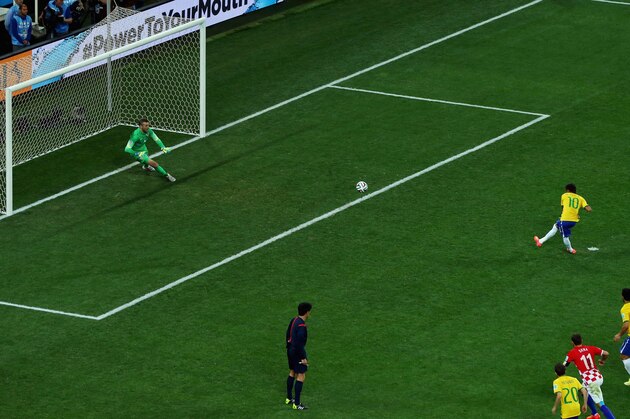SAO PAULO, BRAZIL - JUNE 12:  Neymar of Brazil takes a penalty kick against Stipe Pletikosa of Croatia during the 2014 FIFA World Cup Brazil Group A match between Brazil and Croatia at Arena de Sao Paulo on June 12, 2014 in Sao Paulo, Brazil.  (Photo by Elsa/Getty Images)