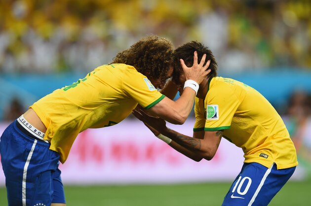 SAO PAULO, BRAZIL - JUNE 12: David Luiz (L) and Neymar of Brazil react after a missed chance in the second half during the 2014 FIFA World Cup Brazil Group A match between Brazil and Croatia at Arena de Sao Paulo on June 12, 2014 in Sao Paulo, Brazil.  (Photo by Buda Mendes/Getty Images)