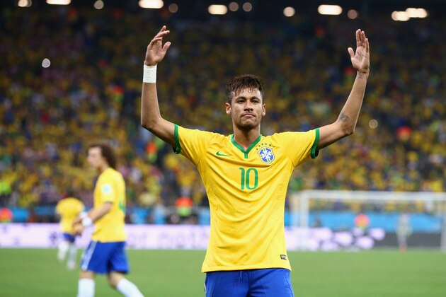SAO PAULO, BRAZIL - JUNE 12:  Neymar of Brazil celebrates after scoring his second goal on a penalty kick in the second half during the 2014 FIFA World Cup Brazil Group A match between Brazil and Croatia at Arena de Sao Paulo on June 12, 2014 in Sao Paulo, Brazil.  (Photo by Adam Pretty/Getty Images)