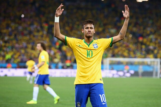 SAO PAULO, BRAZIL - JUNE 12:  Neymar of Brazil celebrates after scoring his second goal on a penalty kick in the second half during the 2014 FIFA World Cup Brazil Group A match between Brazil and Croatia at Arena de Sao Paulo on June 12, 2014 in Sao Paulo, Brazil.  (Photo by Adam Pretty/Getty Images)