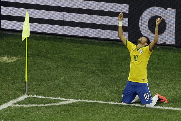 Brazil's Neymar celebrates scoring his side's 2nd goal during the group A World Cup soccer match between Brazil and Croatia, the opening game of the tournament, in the Itaquerao Stadium in Sao Paulo, Brazil, Thursday, June 12, 2014. (AP Photo/Thanassis Stavrakis)