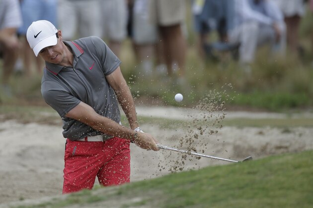 Rory McIlroy, of Northern Ireland, hits out of the bunker on the 6th hole during the first round of the U.S. Open golf tournament in Pinehurst, N.C., Thursday, June 12, 2014. (AP Photo/Eric Gay)