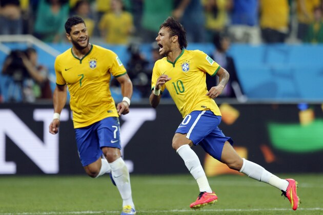 Brazil's Neymar, right, celebrates with teammate Hulk after scoring during the group A World Cup soccer match against Croatia in the opening game of the tournament at Itaquerao Stadium in Sao Paulo, Brazil, Thursday, June 12, 2014. (AP Photo/Frank Augstein)