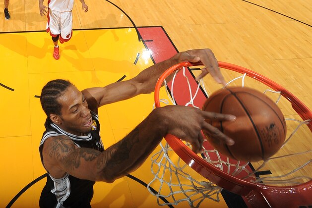 MIAMI, FL - JUNE 10: Kawhi Leonard #2 of the San Antonio Spurs dunks during Game Three of the 2014 NBA Finals between the Miami Heat and San Antonio Spurs at the American Airlines Arena on June 10, 2014 in Miami, Florida. NOTE TO USER: User expressly acknowledges and agrees that, by downloading and/or using this photograph, user is consenting to the terms and conditions of the Getty Images License Agreement.  Mandatory Copyright Notice: Copyright 2014 NBAE (Photo by Andrew D Bernstein/NBAE via Getty Images)