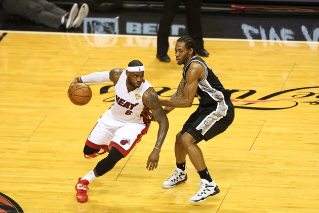MIAMI, FL - JUNE 12: LeBron James #6 of the Miami Heat drives against Kawhi Leonard #2 of the San Antonio Spurs during Game Four of the 2014 NBA Finals at American Airlines Arena on June 12, 2014 in Miami, Florida. NOTE TO USER: User expressly acknowledges and agrees that, by downloading and/or using this photograph, user is consenting to the terms and conditions of the Getty Images License Agreement.  Mandatory Copyright Notice: Copyright 2014 NBAE (Photo by Joe Murphy/NBAE via Getty Images)