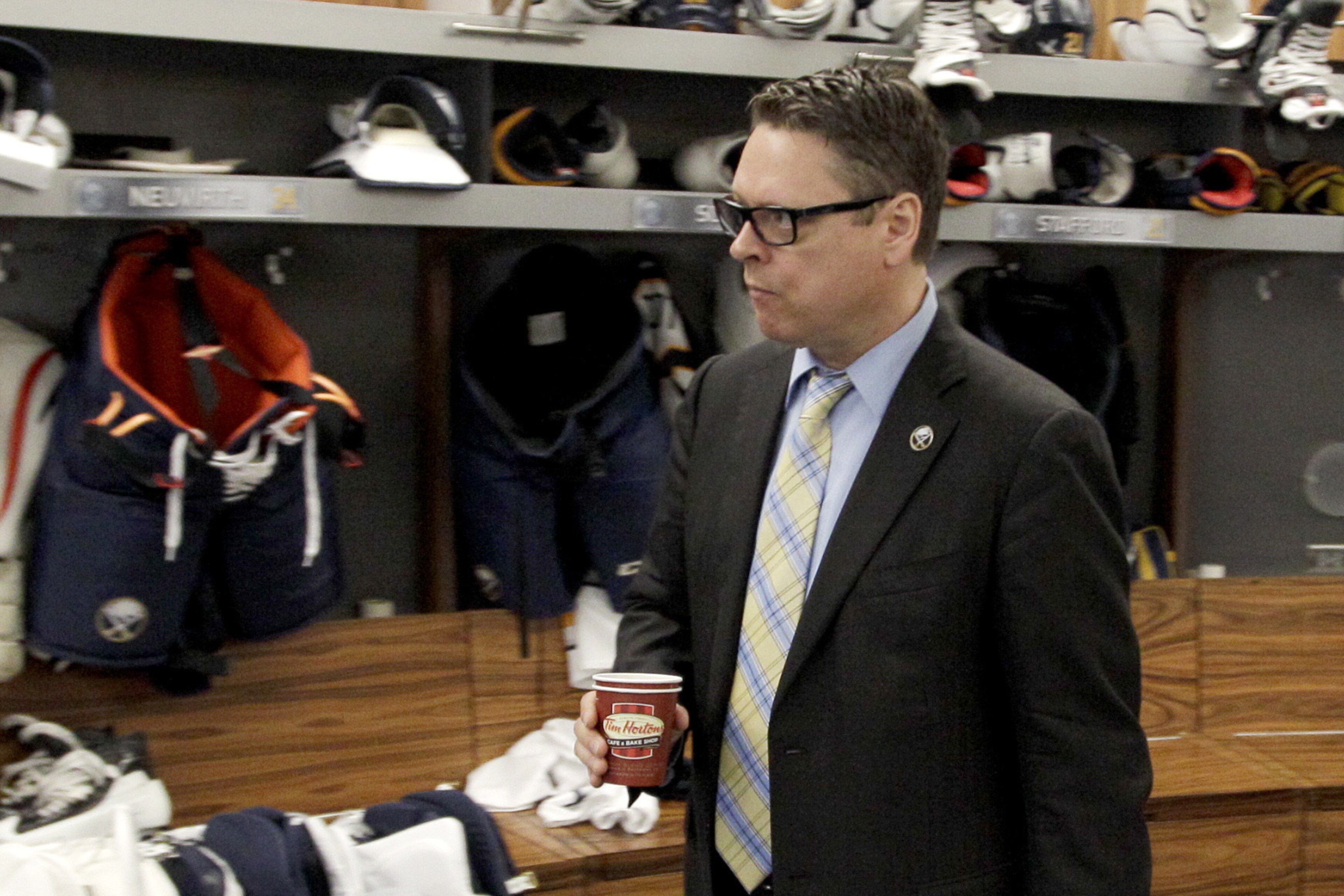 Buffalo Sabres general manager Tim Murray exits the Sabres locker room after players gathered for the last time on Monday, April 14, 2014, in Buffalo, N.Y. (AP Photo/Nick LoVerde)