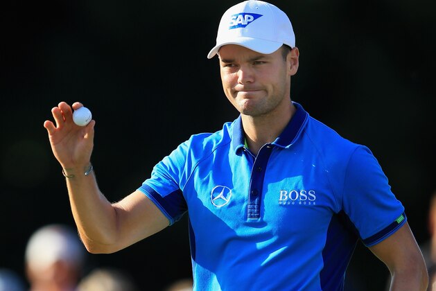 PINEHURST, NC - JUNE 12:  Martin Kaymer of Germany waves to the gallery on the 18th green after his fiver-under par 65 during the first round of the 114th U.S. Open at Pinehurst Resort & Country Club, Course No. 2 on June 12, 2014 in Pinehurst, North Carolina.  (Photo by David Cannon/Getty Images)