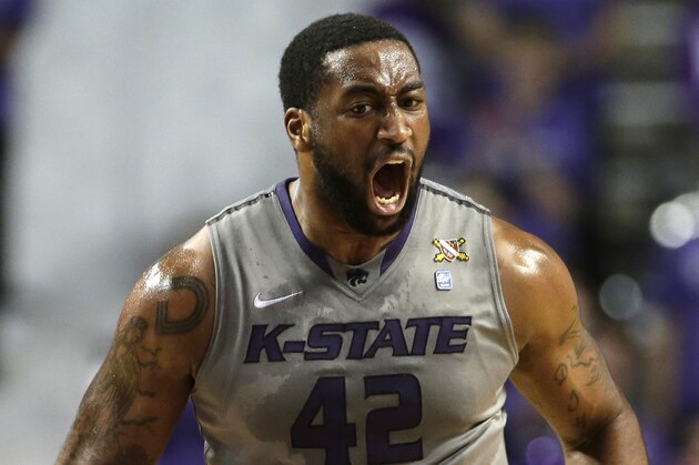Kansas State's Thomas Gipson reacts after sinking a basket during the first half of an NCAA college basketball game against Iowa State  Saturday, March 1, 2014, in Manhattan, Kan. (AP Photo/Charlie Riedel)