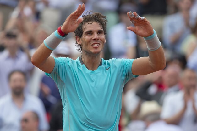 Jun 8, 2014; Paris, France; Rafael Nadal (ESP) celebrates recording match point in his match against Novak Djokovic (SRB) on day 15 at the 2014 French Open at Roland Garros. Mandatory Credit: Susan Mullane-USA TODAY Sports