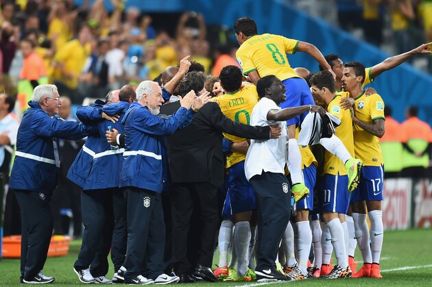 SAO PAULO, BRAZIL - JUNE 12:  The Brazilian team celebrate victory after the 2014 FIFA World Cup Brazil Group A match between Brazil and Croatia at Arena de Sao Paulo on June 12, 2014 in Sao Paulo, Brazil.  (Photo by Buda Mendes/Getty Images)