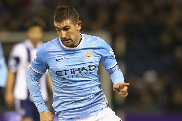 WEST BROMWICH, ENGLAND - DECEMBER 04:  Aleksandar Kolarov of Manchester City runs with the ball during the Premier League match between West Bromwich Albion and Manchester City at The Hawthorns on December 4, 2013 in West Bromwich, England.  (Photo by David Rogers/Getty Images)