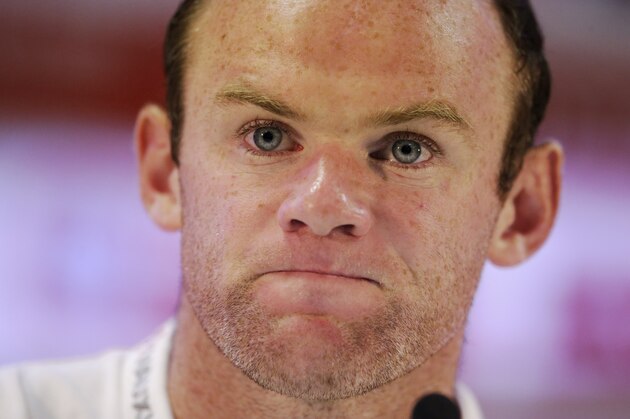 England national soccer team player Wayne Rooney listens to a journalist's question during a press conference after a training session for the 2014 soccer World Cup at the Urca military base in Rio de Janeiro, Brazil, Wednesday, June 11, 2014.  The England soccer team are staying in Rio de Janeiro as their base city for the 2014 soccer World Cup.  (AP Photo/Matt Dunham)