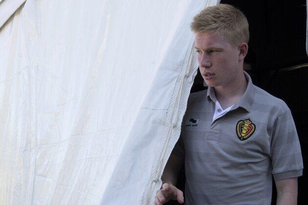 Belgium midfielder Kevin De Bruyne leaves at the end of a press conference at the team's training facility, in Mogi Das Cruzes, Brazil, Thursday, June 12, 2014. Belgium plays in the group H of the 2014 soccer World Cup. (AP Photo/Andrew Medichini)