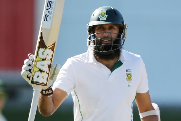PORT ELIZABETH, SOUTH AFRICA - FEBRUARY 22: Hashim Amla of South Africa celebrates reaching 50 runs during day three of the Second Test match between South Africa and Australia at AXXESS St George's Cricket Stadium on February 22, 2014 in Port Elizabeth, South Africa.  (Photo by Morne de Klerk/Getty Images)