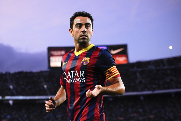 BARCELONA, SPAIN - SEPTEMBER 14:  Xavi Hernandez of FC Barcelona looks on  during the La Liga match between FC Barcelona and Sevilla FC at Camp Nou on September 14, 2013 in Barcelona, Spain.  (Photo by David Ramos/Getty Images)