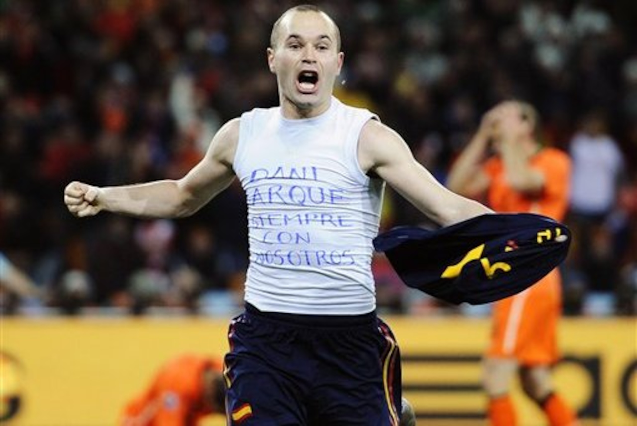 Spain's Andres Iniesta celebrates after scoring a goal, with the words
