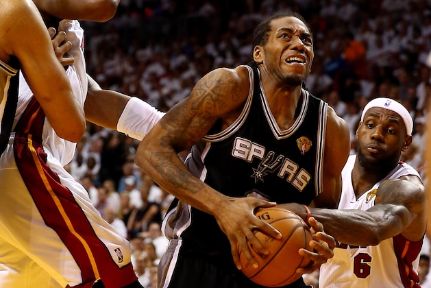 MIAMI, FL - JUNE 12: Kawhi Leonard #2 of the San Antonio Spurs drives to the basket as LeBron James #6 of the Miami Heat defends during Game Four of the 2014 NBA Finals at American Airlines Arena on June 12, 2014 in Miami, Florida. NOTE TO USER: User expressly acknowledges and agrees that, by downloading and or using this photograph, User is consenting to the terms and conditions of the Getty Images License Agreement.  (Photo by Andy Lyons/Getty Images)