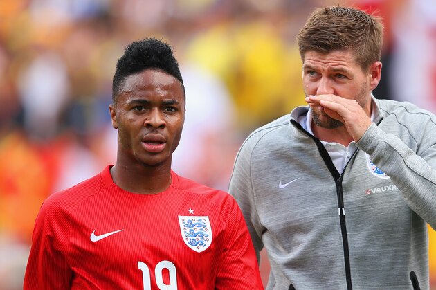 MIAMI GARDENS, FL - JUNE 04:  Steven Gerrard of England speaks with Raheem Sterling of England after he was shown a red card  during the International friendly match between England and Ecuador at Sun Life Stadium on June 4, 2014 in Miami Gardens, Florida.  (Photo by Richard Heathcote/Getty Images)