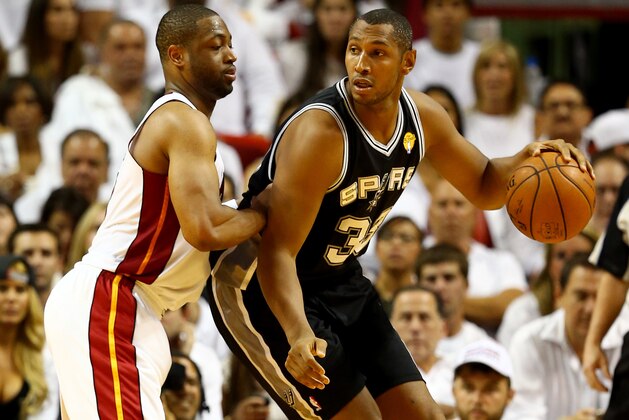 MIAMI, FL - JUNE 12: Boris Diaw #33 of the San Antonio Spurs looks to pass as Dwyane Wade #3 of the Miami Heat defends during Game Four of the 2014 NBA Finals at American Airlines Arena on June 12, 2014 in Miami, Florida. NOTE TO USER: User expressly acknowledges and agrees that, by downloading and or using this photograph, User is consenting to the terms and conditions of the Getty Images License Agreement.  (Photo by Andy Lyons/Getty Images)