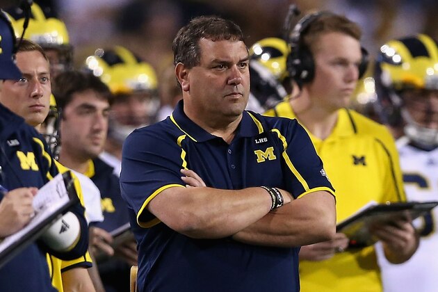 TEMPE, AZ - DECEMBER 28:  Head coach Brady Hoke of the Michigan Wolverines on the sidelines during the Buffalo Wild Wings Bowl against the Kansas State Wildcats at Sun Devil Stadium on December 28, 2013 in Tempe, Arizona.   The Wildcats defeated the Wolverines 31-14.  (Photo by Christian Petersen/Getty Images)