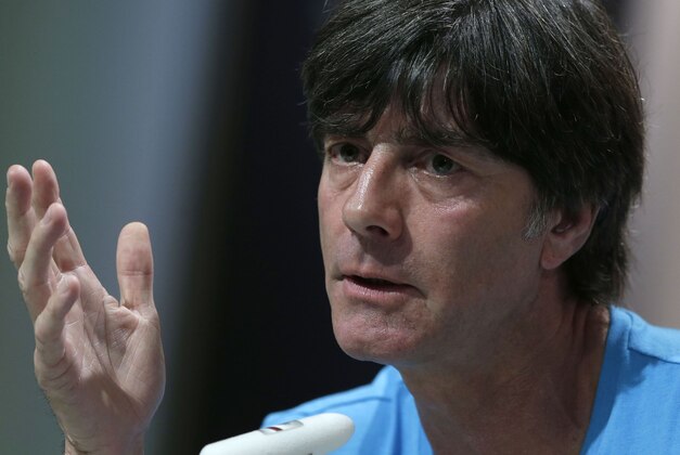 German national soccer team head coach Joachim Loew answers to questions of journalists during a news conference in Santo Andre near Porto Seguro, Brazil, Thursday, June 12, 2014. Germany will play in group G of the 2014 soccer World Cup. (AP Photo/Matthias Schrader)