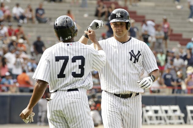 New York Yankees Gary Sanchez, right, celebrates his two run home run with teammate Antoan Richardson during the ninth inning of their exhibition baseball game against the Miami Marlins, a Legend Series game in honor of Mariano Rivera in Panama City, Sunday, March 16, 2014. (AP Photo/Arnulfo Franco)