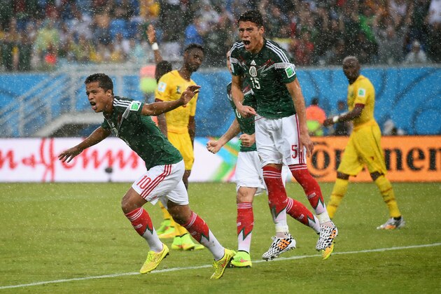 NATAL, BRAZIL - JUNE 13:  Giovani dos Santos (L) and Hector Moreno of Mexico react after a goal by dos Santos was disallowed due to an offsides call in the first half during the 2014 FIFA World Cup Brazil Group A match between Mexico and Cameroon at Estadio das Dunas on June 13, 2014 in Natal, Brazil.  (Photo by Matthias Hangst/Getty Images)