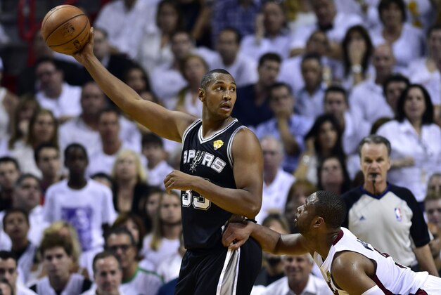 Jun 12, 2014; Miami, FL, USA; San Antonio Spurs forward Boris Diaw (33) keeps the ball away from Miami Heat guard Dwyane Wade (3) during the second quarter of game four of the 2014 NBA Finals at American Airlines Arena. Mandatory Credit: Bob Donnan-USA TODAY Sports