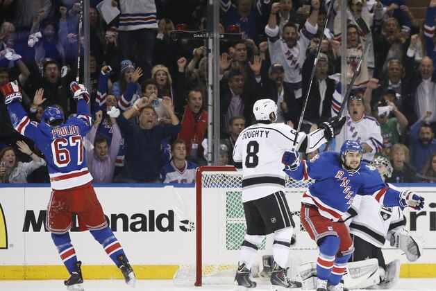 New York Rangers right wing Mats Zuccarello (36), at right, and left wing Benoit Pouliot (67) react after Pouliot scored a goal against the Los Angeles Kings in the first period during Game 4 of the NHL hockey Stanley Cup Final, Wednesday, June 11, 2014, in New York. (AP Photo/Kathy Willens)