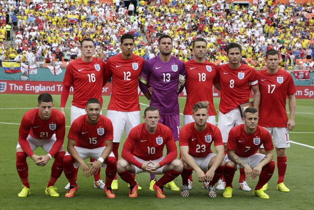 England players pose for photographers before a friendly soccer match against Ecuador in Miami Gardens, Fla., Wednesday, June 4, 2014. (AP Photo/Alan Diaz)