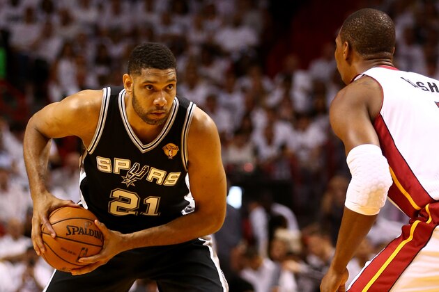 MIAMI, FL - JUNE 10:  Tim Duncan #21 of the San Antonio Spurs looks to pass against the Miami Heat during Game Three of the 2014 NBA Finals at American Airlines Arena on June 10, 2014 in Miami, Florida. NOTE TO USER: User expressly acknowledges and agrees that, by downloading and or using this photograph, User is consenting to the terms and conditions of the Getty Images License Agreement.  (Photo by Andy Lyons/Getty Images)