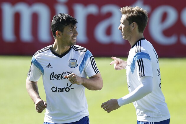 Argentina's Sergio Aguero, left, talks to teammate Lucas Biglia, right, during a training session in Vespasiano, near Belo Horizonte, Brazil, Friday, June, 13, 2014. Argentina will play in group F of the Brazil 2014 soccer World Cup. (AP Photo/Victor R. Caivano)