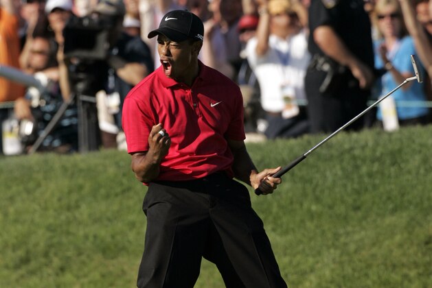 Tiger Woods reacts after sinking a birdie putt on the 18th green forcing a playoff against Rocco Mediate during the fourth round of the US Open championship at Torrey Pines Golf Course on Sunday, June 15, 2008 in San Diego.  (AP Photo/Chris O'Meara)