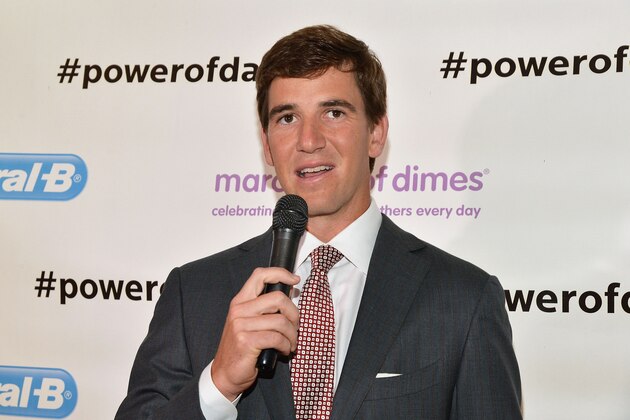 NEW YORK, NY - JUNE 11:  New York Giants' quarterback Eli Manning celebrates Father's Day at Studio Arte on June 11, 2014 in New York City.  (Photo by Slaven Vlasic/Getty Images)