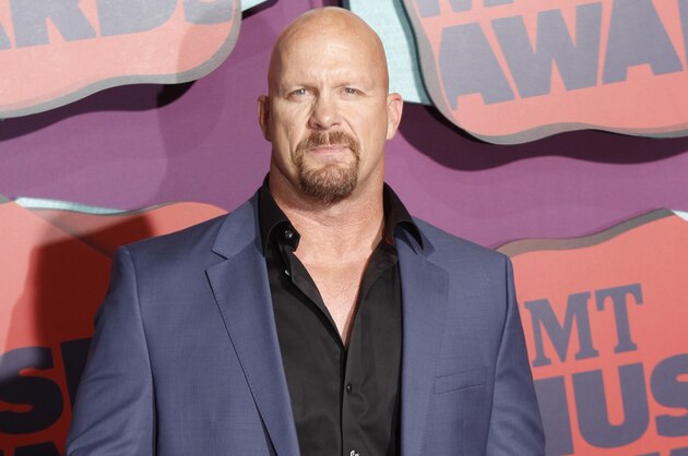 Steve Austin arrives at the CMT Music Awards at Bridgestone Arena on Wednesday, June 4, 2014, in Nashville, Tenn. (Photo by Wade Payne/Invision/AP)