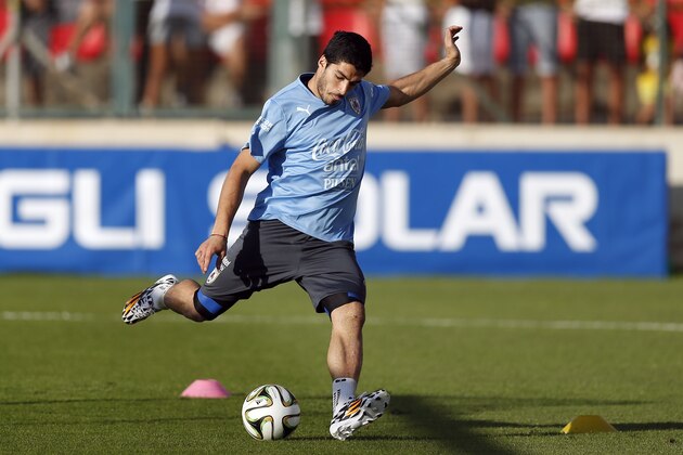 Uruguay's Luis Suarez kicks a ball during a training session at Jacare Stadium in Sete Lagoas, Brazil,  Tuesday, June 10, 2014. Uruguay continues its preparations for the upcoming 2014 World Cup. (AP Photo/Victor R. Caivano)
