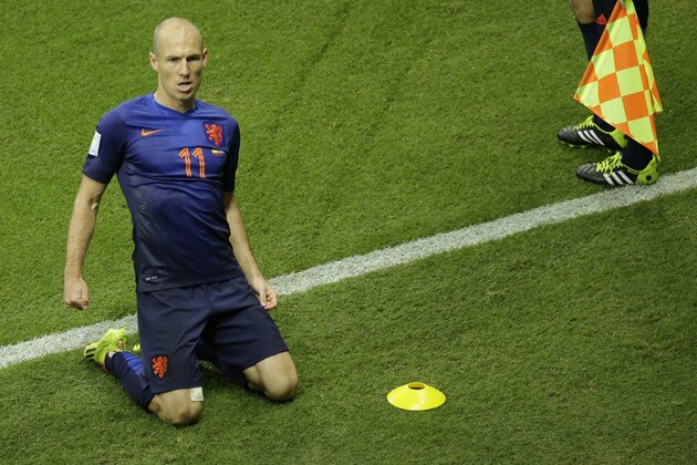 Netherlands' Arjen Robben celebrates after scoring during the group B World Cup soccer match between Spain and the Netherlands at the Arena Ponte Nova in Salvador, Brazil, Friday, June 13, 2014.  (AP Photo/Christophe Ena)