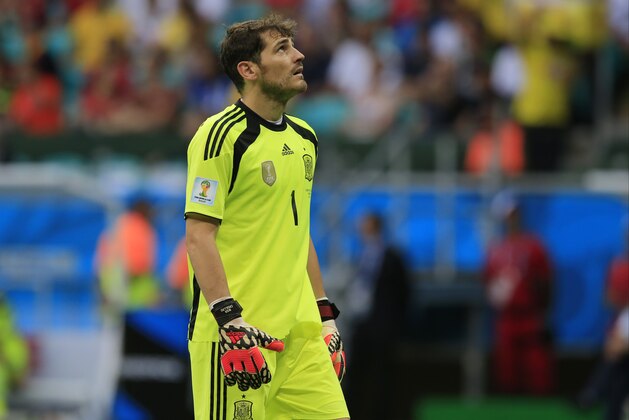 Spain's goalkeeper Iker Casillas reacts during the group B World Cup soccer match between Spain and the Netherlands at the Arena Ponte Nova in Salvador, Brazil, Friday, June 13, 2014. (AP Photo/Bernat Armangue)