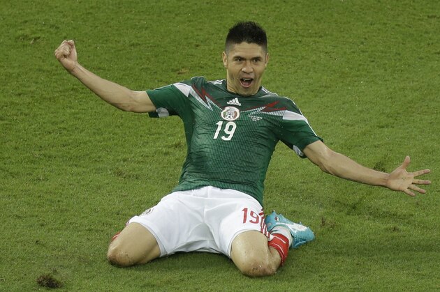 Mexico's Oribe Peralta celebrates after scoring during the group A World Cup soccer match between Mexico and Cameroon in the Arena das Dunas in Natal, Brazil, Friday, June 13, 2014. (AP Photo/Hassan Ammar) Mexico's Oribe Peralta celebrates after scoring during the group A World Cup soccer match between Mexico and Cameroon in the Arena das Dunas in Natal, Brazil, Friday, June 13, 2014. (AP Photo/Hassan Ammar)