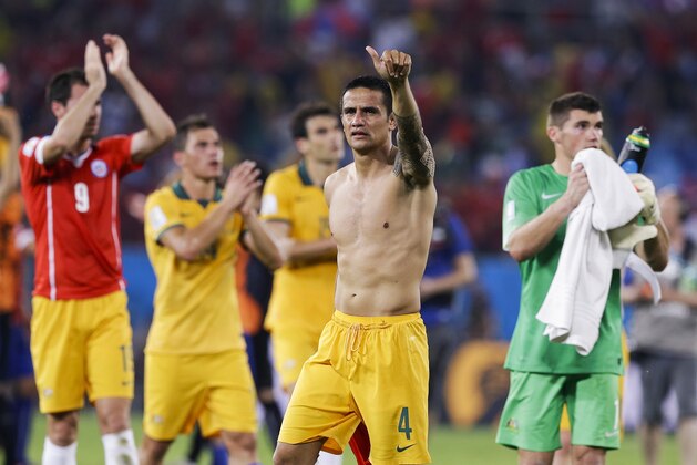 Australia's Tim Cahill (4) salutes spectators following their 3-1 loss to Chile during the group B World Cup soccer match between Chile and Australia in the Arena Pantanal in Cuiaba, Brazil, Friday, June 13, 2014. (AP Photo/Thanassis Stavrakis)