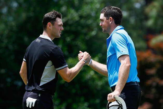 PINEHURST, NC - JUNE 13:  Martin Kaymer of Germany (L) shakes hands with Keegan Bradley of the United States on the ninth green after Kaymer shot a five-under par 65 during the second round of the 114th U.S. Open at Pinehurst Resort & Country Club, Course No. 2 on June 13, 2014 in Pinehurst, North Carolina.  (Photo by Sam Greenwood/Getty Images)