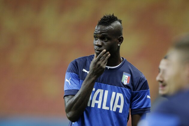 Italy's Mario Balotelli takes part in a training session of the Italy national soccer team at the Arena da Amazonia in Manaus, Brazil, Friday, June 13, 2014.  England play Italy in group D of the 2014 soccer World Cup at the stadium on Saturday. (AP Photo/Matt Dunham)