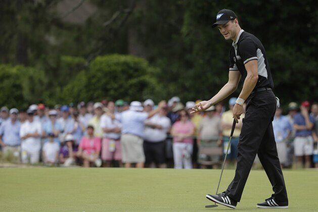 Martin Kaymer, of Germany, reacts after missing a putt on the ninth hole during the second round of the U.S. Open golf tournament in Pinehurst, N.C., Friday, June 13, 2014. (AP Photo/Chuck Burton)