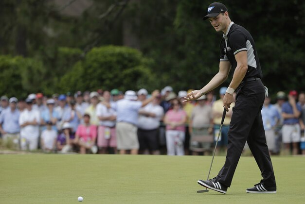 Martin Kaymer, of Germany, reacts after missing a putt on the ninth hole during the second round of the U.S. Open golf tournament in Pinehurst, N.C., Friday, June 13, 2014. (AP Photo/Chuck Burton)