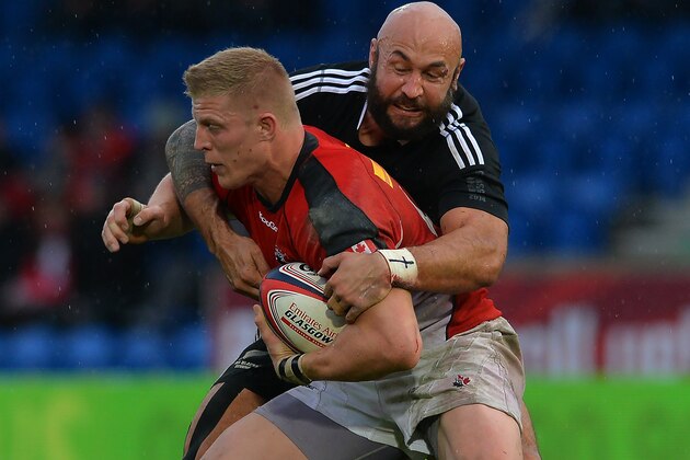 GLASGOW, SCOTLAND - MAY 04: Ben Lam of New Zealand tackles John Moonlight of Canada during the IRB Glasgow Sevens - Day Two at Scotstoun Stadium on May 4 2014 in Glasgow, Scotland. (Photo by Mark Runnacles/Getty Images) GLASGOW, SCOTLAND - MAY 04: Ben Lam of New Zealand tackles John Moonlight of Canada during the IRB Glasgow Sevens - Day Two at Scotstoun Stadium on May 4 2014 in Glasgow, Scotland. (Photo by Mark Runnacles/Getty Images)