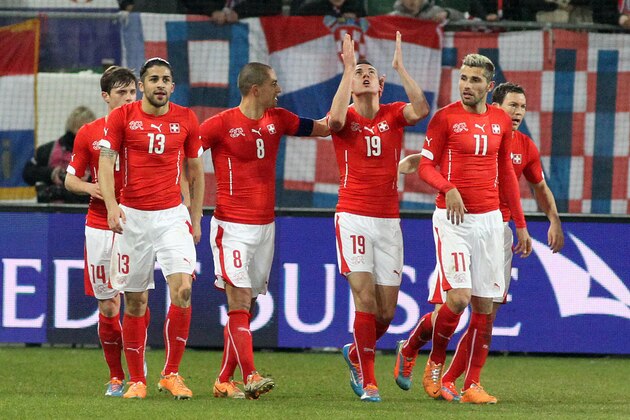 ST GALLEN, SWITZERLAND - MARCH 05: (L-R) Ricardo Rodriguez, Goekhan Inler, Josip Drmic and Valon Behrami of Switzerland celebrate the first goal of the match during the international friendly match between Switzerland and Croatia at the AFG Arena on March 5, 2014 in St Gallen, Switzerland.  (Photo by Marc Eich/Getty Images)