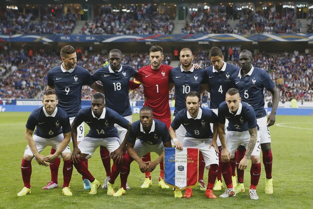 French soccer team players pose before the international friendly match between France and Jamaica at the Lille Metropole stadium, in Villeneuve d'Ascq, northern France, Sunday, June 8, 2014. From left background: Olivier Giroud, Moussa Sissoko, Hugo Lloris, Karim Benzema, Raphael Varane, Mamadou Sakho, and foreground from left, Yohan Cabaye, Blaise Matuidi, Patrice Evra, Mathieu Valbuena and Mathieu Debuchy, as France prepare for the upcoming FIFA soccer World Cup in Brazil starting on 12 June. (AP Photo/Jacques Brinon)
