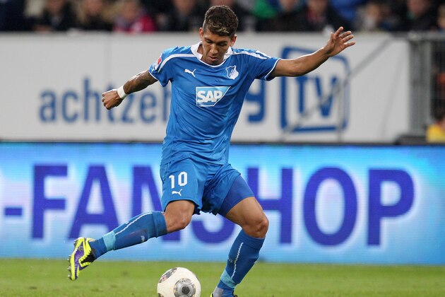 Hoffenheim's Roberto Firmino of Brazil kicks  the ball during a German first division Bundesliga soccer match between TSG 1899 Hoffenheim and Bayern Munich in Sinsheim, Germany, Saturday, Nov.2, 2013. (AP Photo/Michael Probst)
